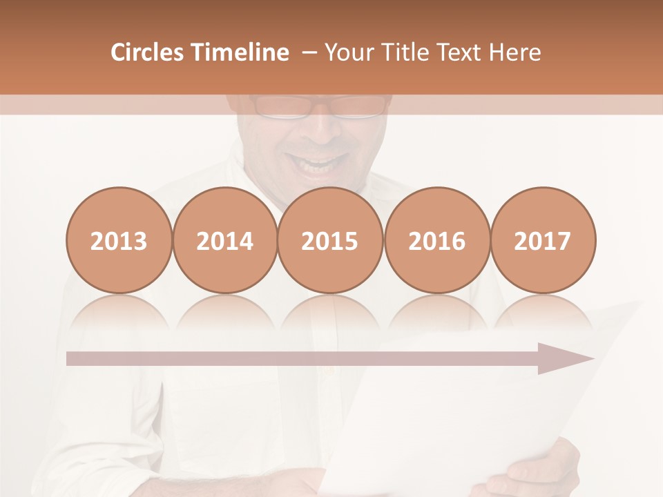 A Man Holding A Piece Of Paper In His Hands PowerPoint Template