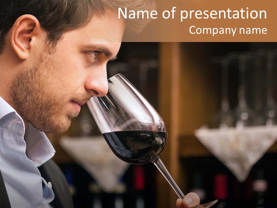 A Man Drinking A Glass Of Red Wine PowerPoint Template