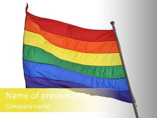 A Rainbow Colored Flag Is Flying In The Wind PowerPoint Template