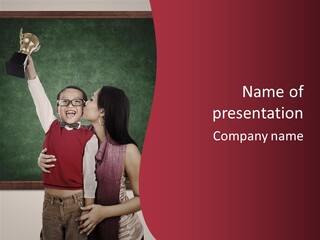 A Man And Woman Kissing In Front Of A Blackboard PowerPoint Template