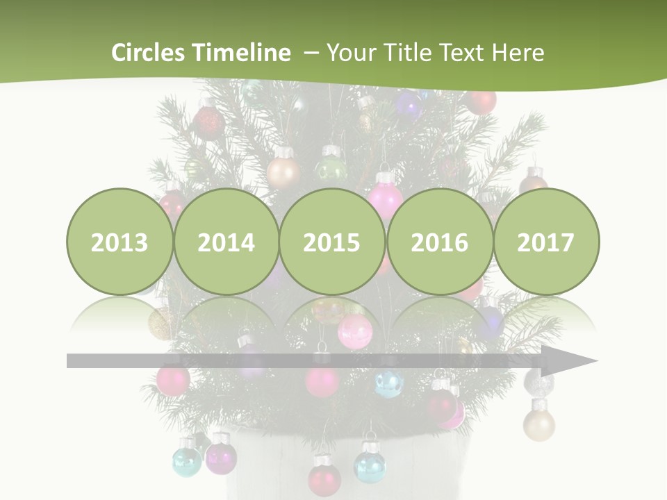 A Small Christmas Tree In A Pot With Ornaments On It PowerPoint Template