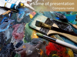 A Paintbrush And Some Paint Sitting On Top Of A Table PowerPoint Template