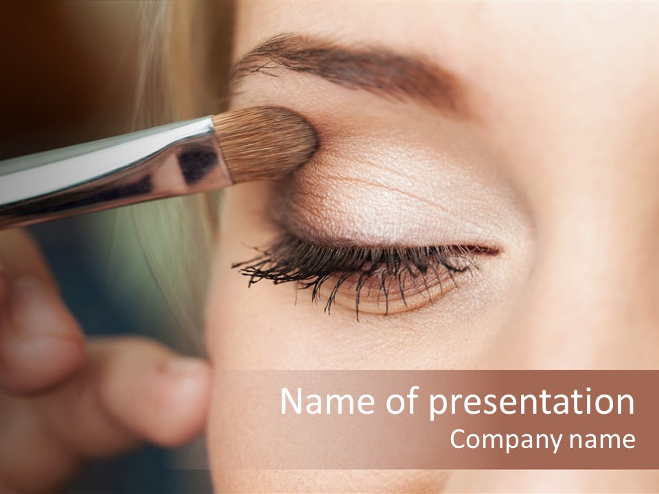 A Woman Is Putting Mascara On Her Eye PowerPoint Template