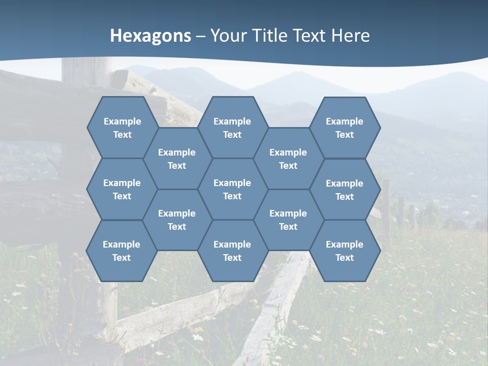 A Wooden Fence In A Grassy Field With Mountains In The Background PowerPoint Template