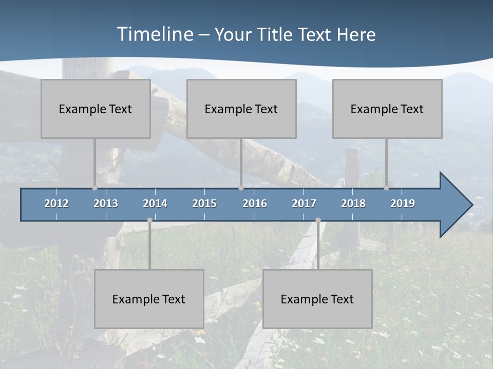 A Wooden Fence In A Grassy Field With Mountains In The Background PowerPoint Template