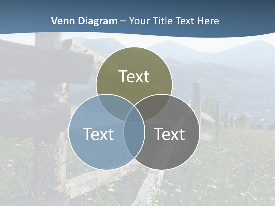 A Wooden Fence In A Grassy Field With Mountains In The Background PowerPoint Template