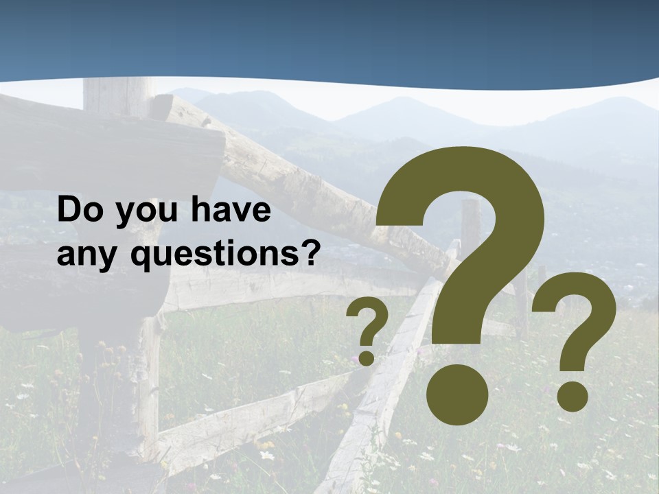 A Wooden Fence In A Grassy Field With Mountains In The Background PowerPoint Template