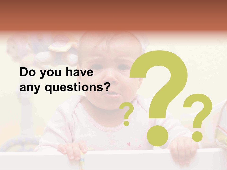 A Baby Is Holding A Toothbrush In His Hand PowerPoint Template