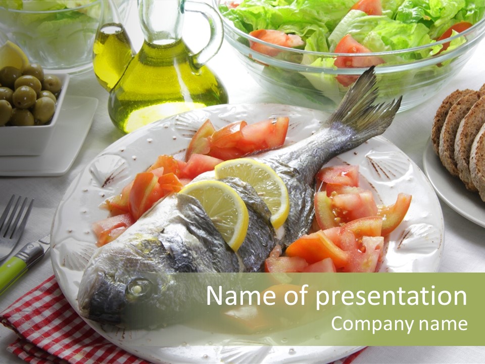 A Fish On A Plate Next To A Salad And Bread PowerPoint Template