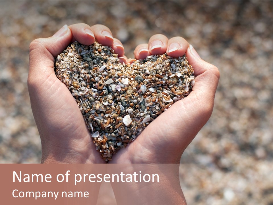 A Person Holding A Heart Shaped Object In Their Hands PowerPoint Template