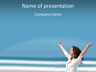 A Woman Standing On The Beach With Her Arms Up PowerPoint Template