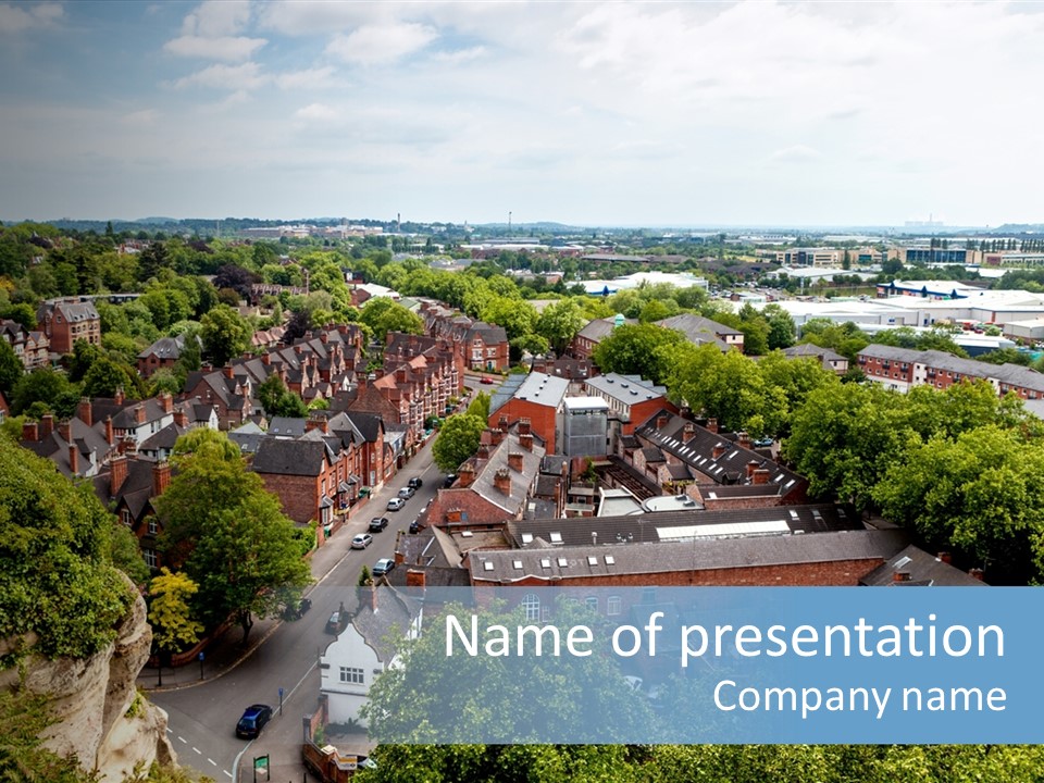 An Aerial View Of A Town With Lots Of Trees PowerPoint Template