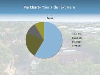 An Aerial View Of A Town With Lots Of Trees PowerPoint Template