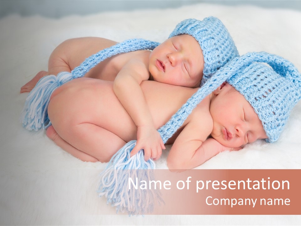 A Couple Of Babies Laying On Top Of Each Other PowerPoint Template