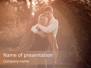 A Man And A Woman Hugging In A Park PowerPoint Template