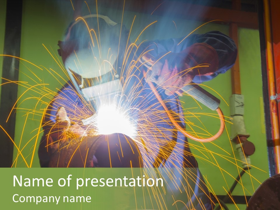 A Welder Working On A Piece Of Metal PowerPoint Template