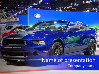A Blue Mustang Car On Display At An Auto Show PowerPoint Template