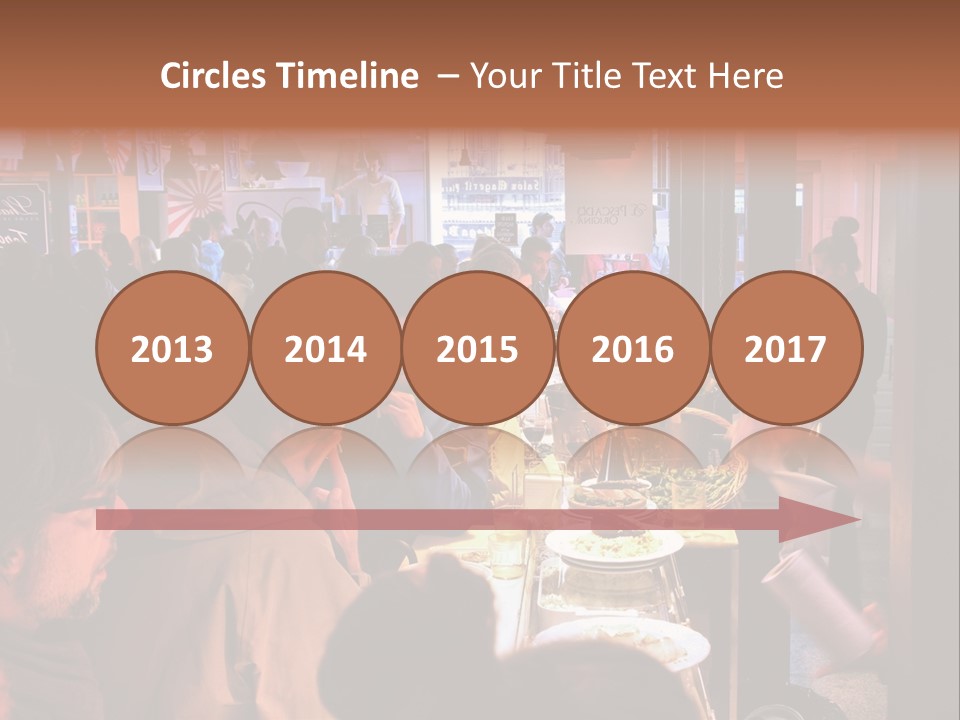 A Group Of People Sitting At A Table In A Restaurant PowerPoint Template