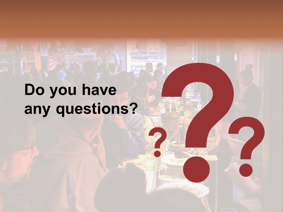 A Group Of People Sitting At A Table In A Restaurant PowerPoint Template
