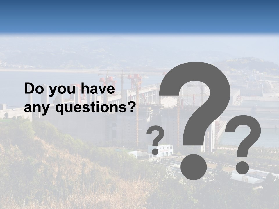 A Power Plant On A Hill Overlooking A Body Of Water PowerPoint Template