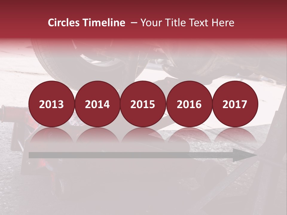 A Close Up Of A Red Jack Under A Car PowerPoint Template