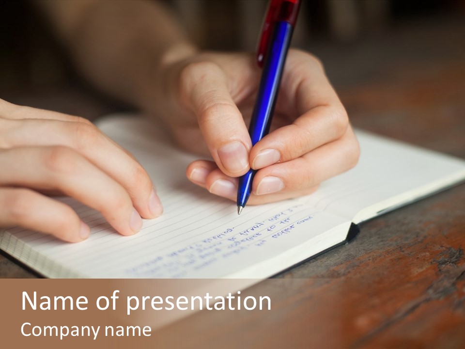 A Person Writing On A Notebook With A Pen PowerPoint Template