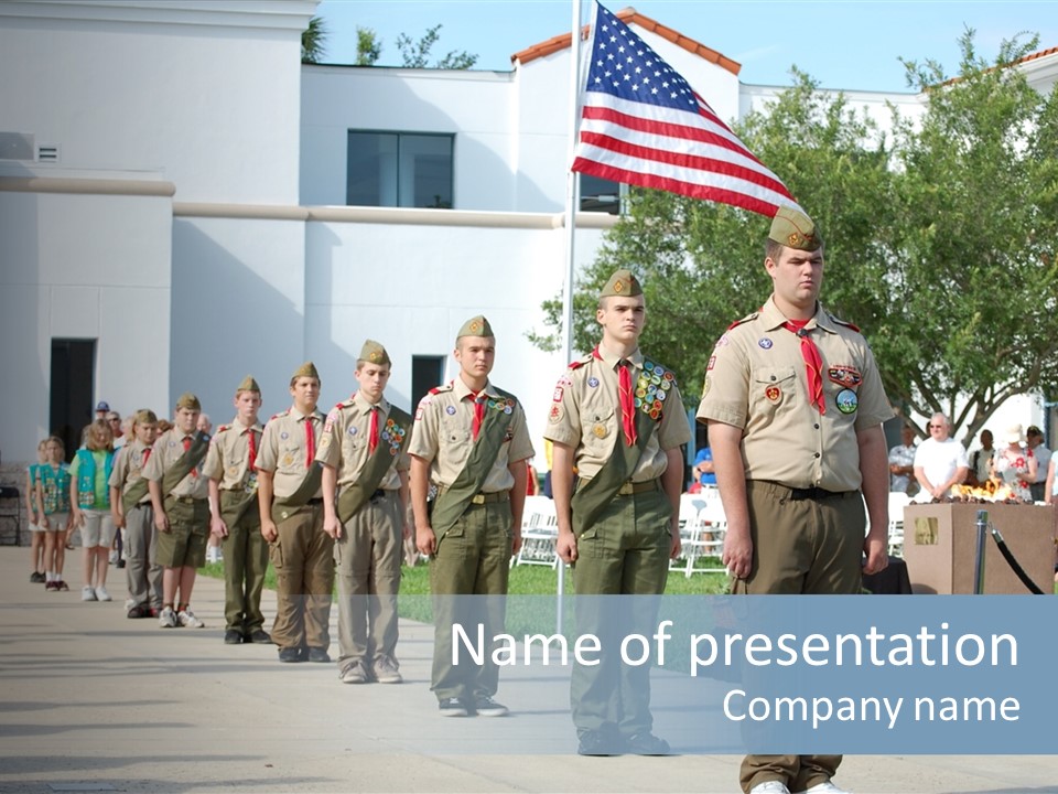 A Group Of Military Men Walking Down A Street PowerPoint Template