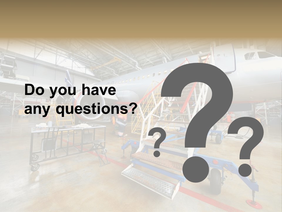 A Large Jetliner Sitting Inside Of A Hangar PowerPoint Template