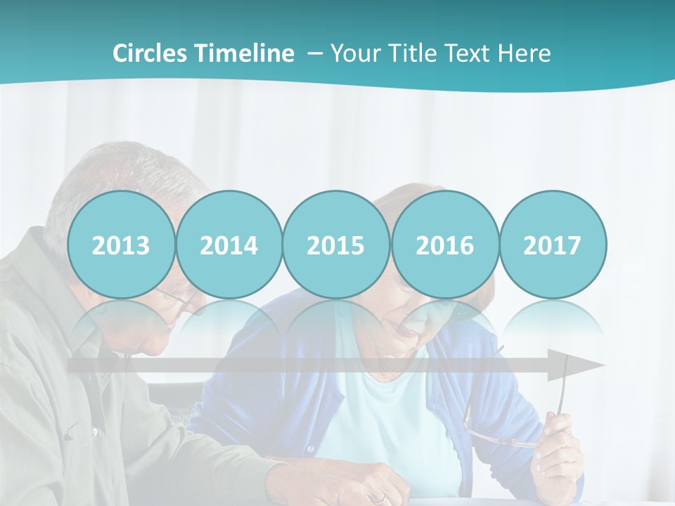 A Man And Woman Sitting At A Table Writing On A Piece Of Paper PowerPoint Template