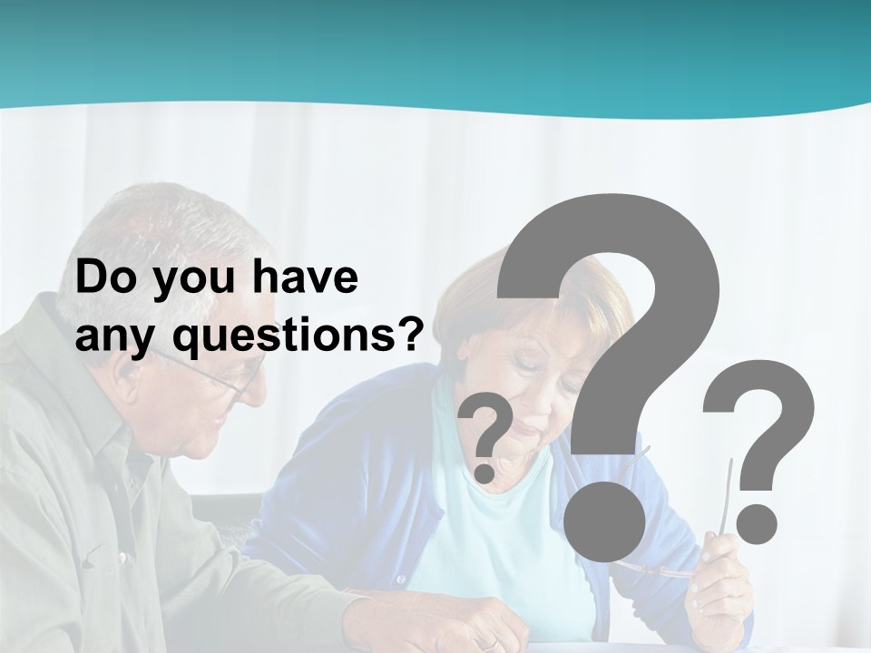 A Man And Woman Sitting At A Table Writing On A Piece Of Paper PowerPoint Template