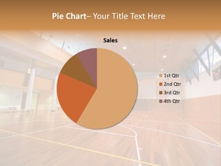 A Large Gymnasium With A Basketball Court And Wooden Floors PowerPoint Template
