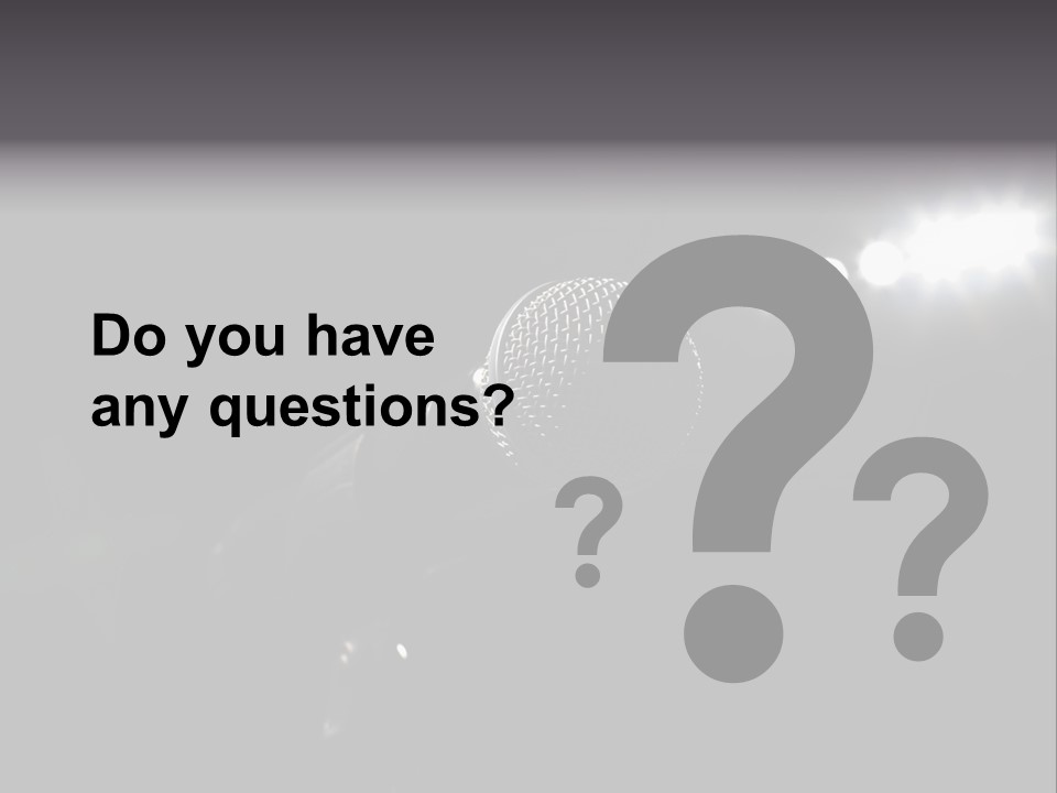 A Microphone In Front Of A Stage With Spotlights PowerPoint Template