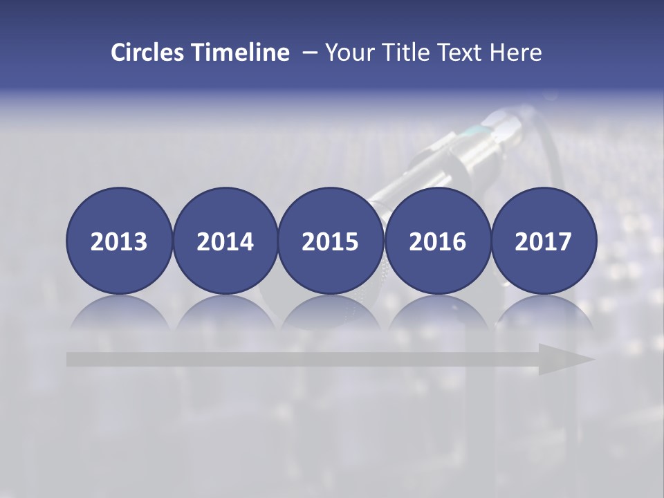 A Microphone In Front Of A Row Of Seats PowerPoint Template