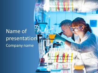 A Couple Of People In A Lab Doing Something PowerPoint Template