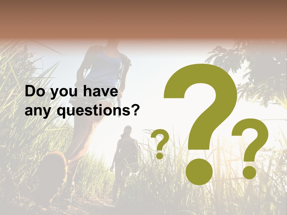 A Couple Of People That Are Walking In The Grass PowerPoint Template