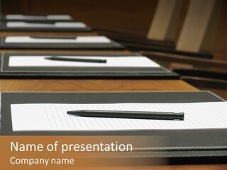 A Table With A Pen And Paper On It PowerPoint Template