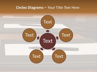 A Table With A Pen And Paper On It PowerPoint Template