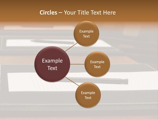 A Table With A Pen And Paper On It PowerPoint Template