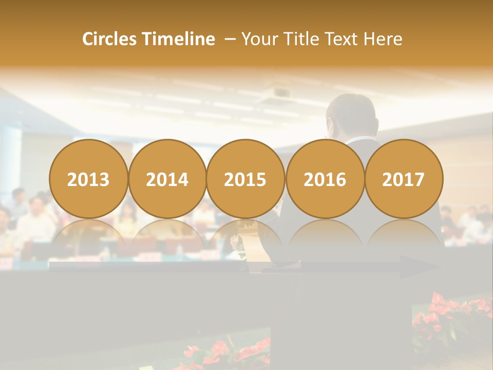 A Man Standing At A Podium In Front Of A Crowd Of People PowerPoint Template