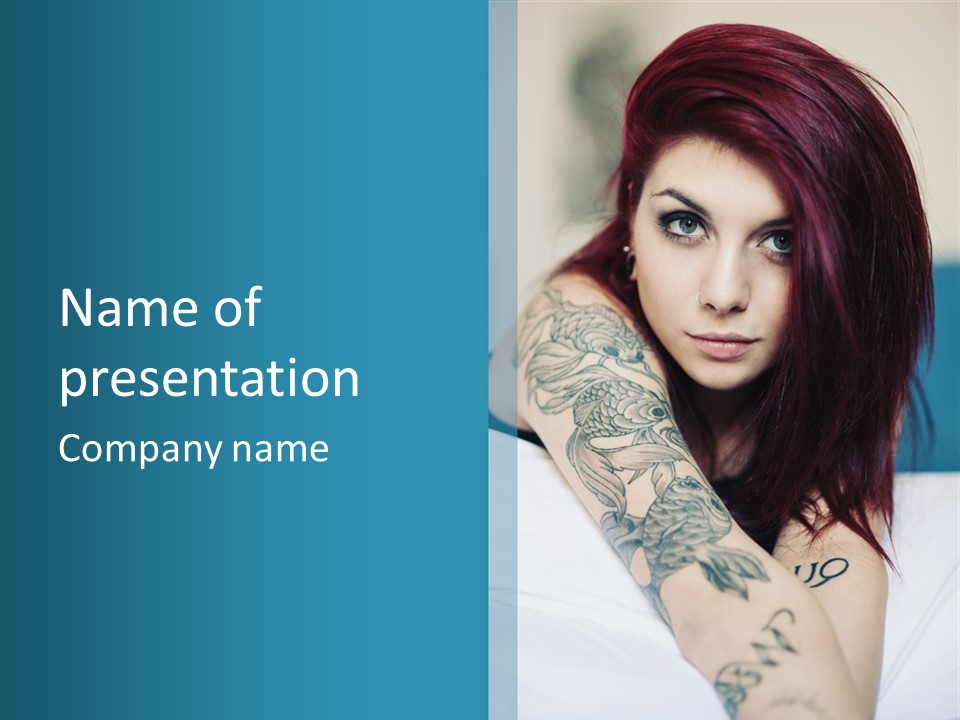 A Woman With Red Hair And Tattoos On Her Arm PowerPoint Template