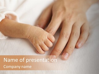 A Person Holding A Baby's Hand On Top Of A Bed PowerPoint Template