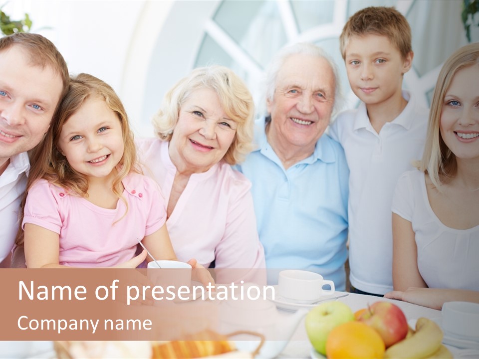 A Group Of People Sitting At A Table With Food PowerPoint Template