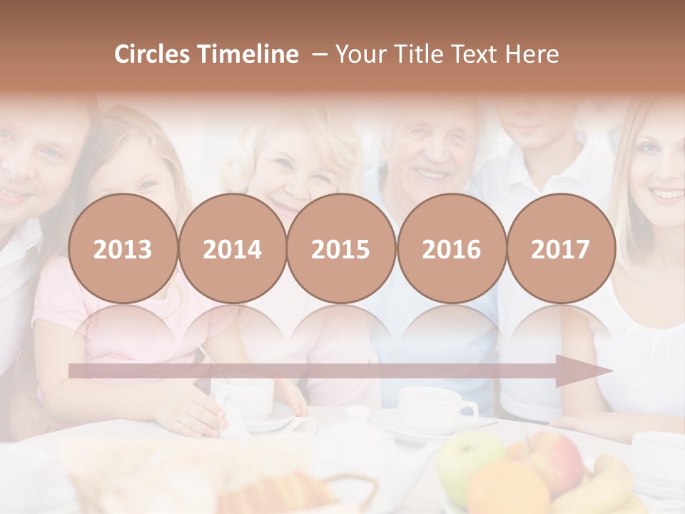 A Group Of People Sitting At A Table With Food PowerPoint Template