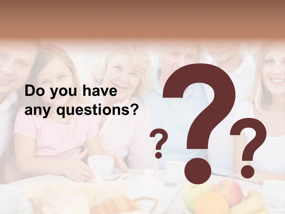 A Group Of People Sitting At A Table With Food PowerPoint Template