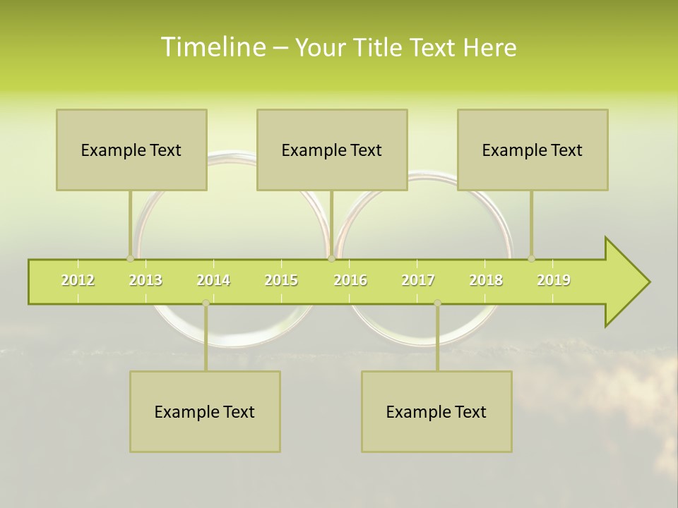 Two Wedding Rings Sitting On A Piece Of Wood PowerPoint Template