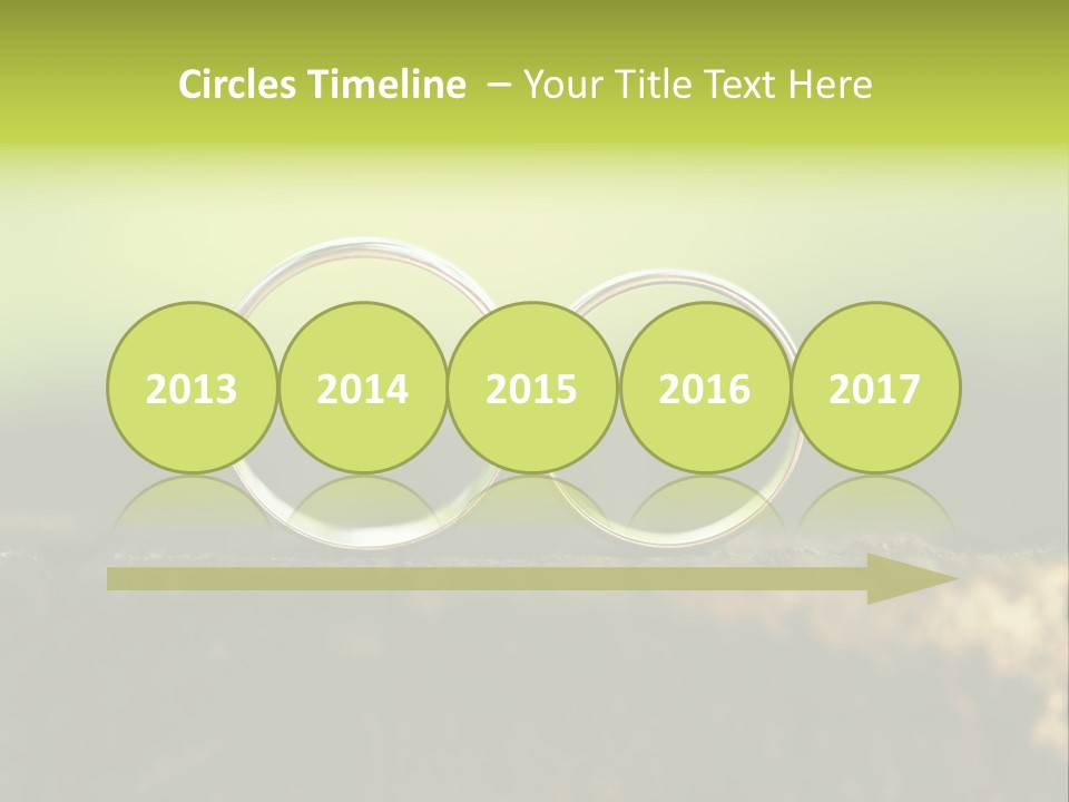 Two Wedding Rings Sitting On A Piece Of Wood PowerPoint Template