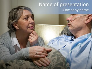 A Man Sitting Next To A Woman On A Couch PowerPoint Template