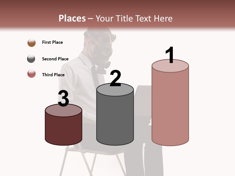 A Man Sitting On A Chair Using A Laptop Computer PowerPoint Template