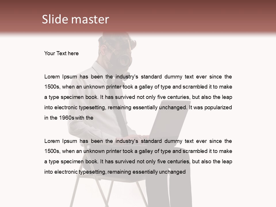 A Man Sitting On A Chair Using A Laptop Computer PowerPoint Template