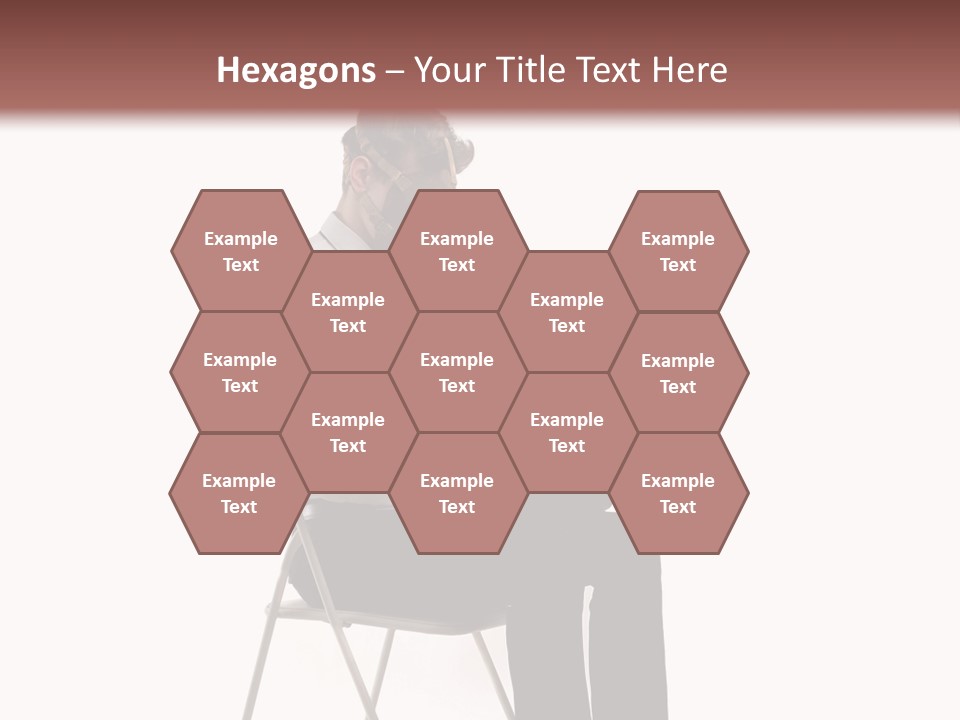 A Man Sitting On A Chair Using A Laptop Computer PowerPoint Template